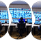Illustration of a logistics control center with multiple monitors displaying a Transportation Management System (TMS) for the trucking industry, showcasing route optimization, real-time tracking, and performance metrics, representing the ultimate guide to TMS for efficient and streamlined transportation operations.